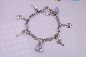 Ready to Wear Charms Bracelet, With Seven Charms Attached, Made from solid Sterling Silver, 7.50 Inches Long, Good Weighty Feel