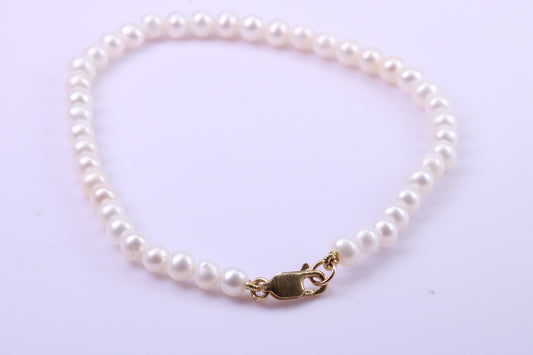 Simple 4 mm Round Natural Freshwater Pearl Bracelet set in Solid Yellow Gold