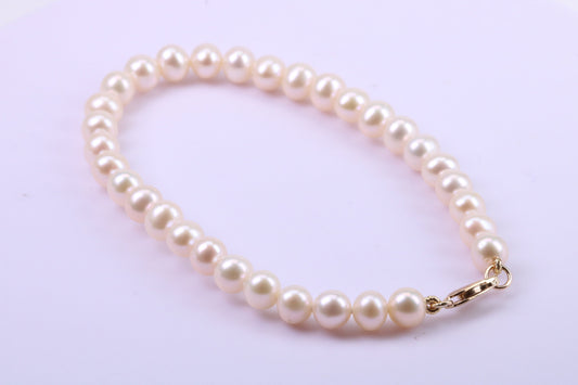 Simple 6 mm Round Natural Freshwater Pearl Bracelet set in Solid Yellow Gold