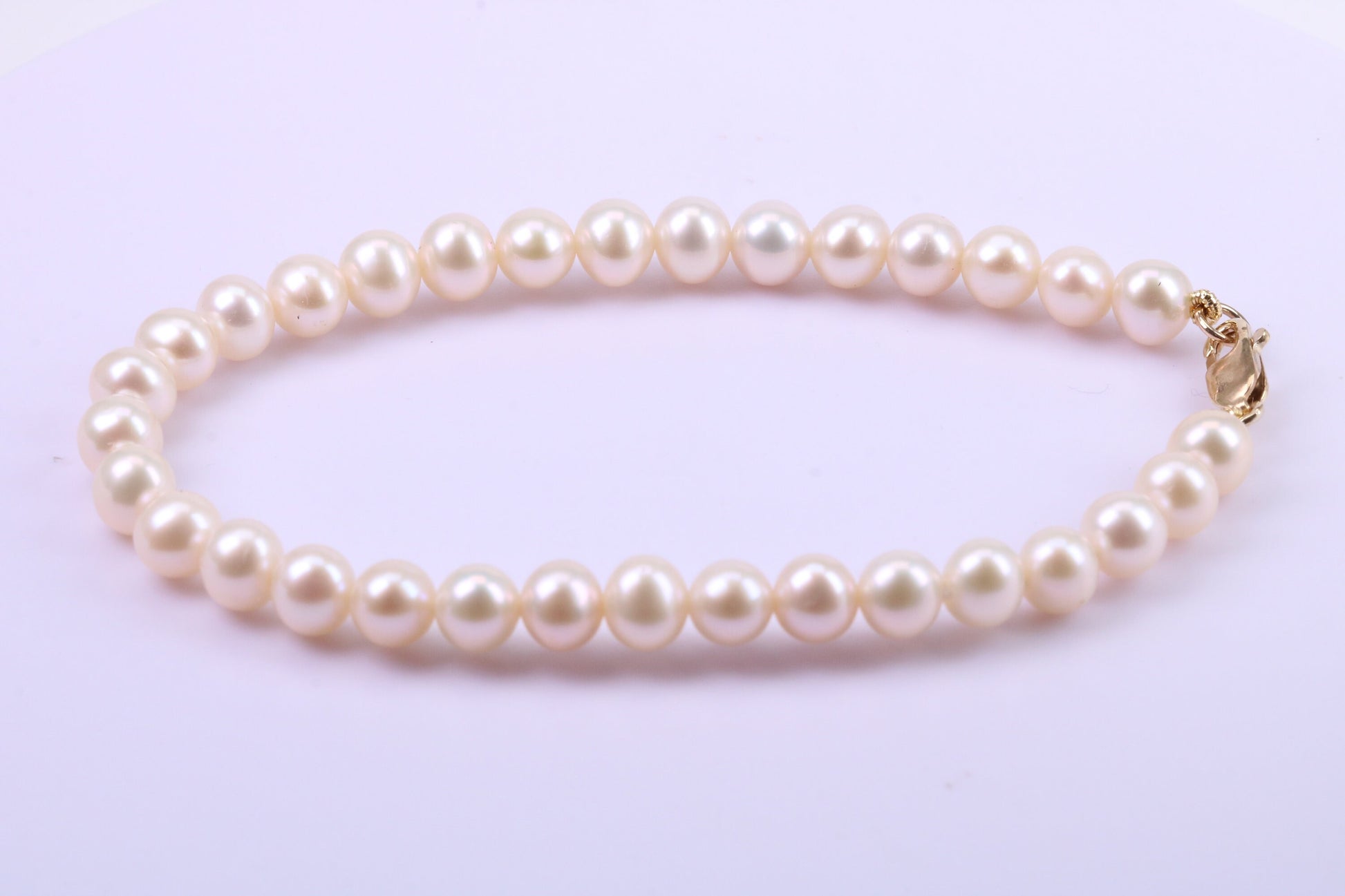 Simple 6 mm Round Natural Freshwater Pearl Bracelet set in Solid Yellow Gold