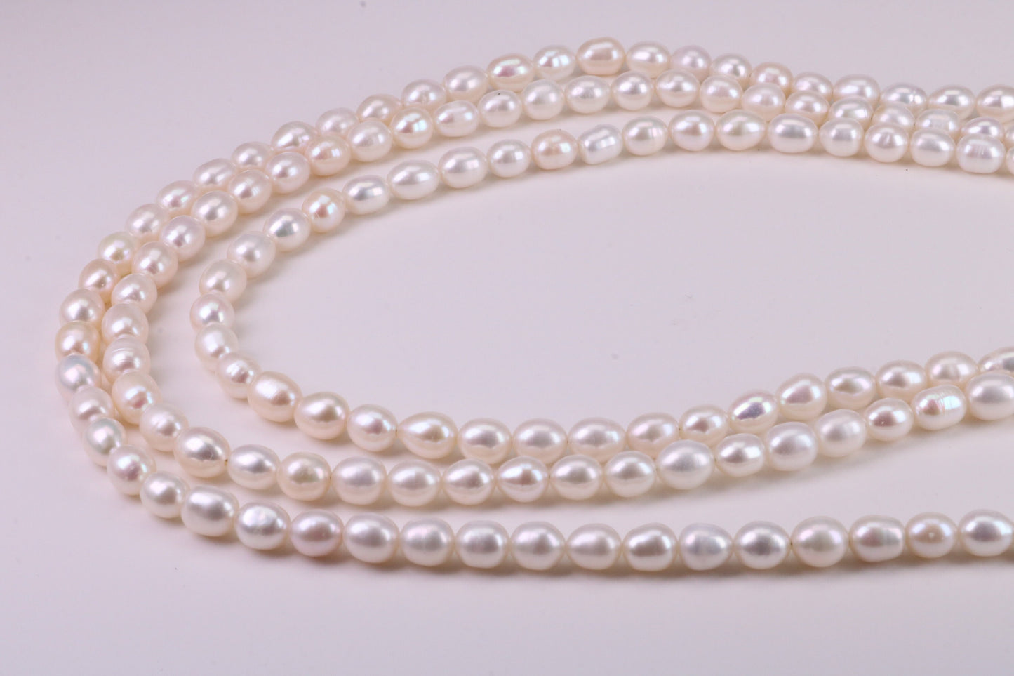 Three Strand Natural 7 mm Oval Shaped Pearl Necklace set in Silver, Three Strands Measures 16, 18 and 20 inches Long