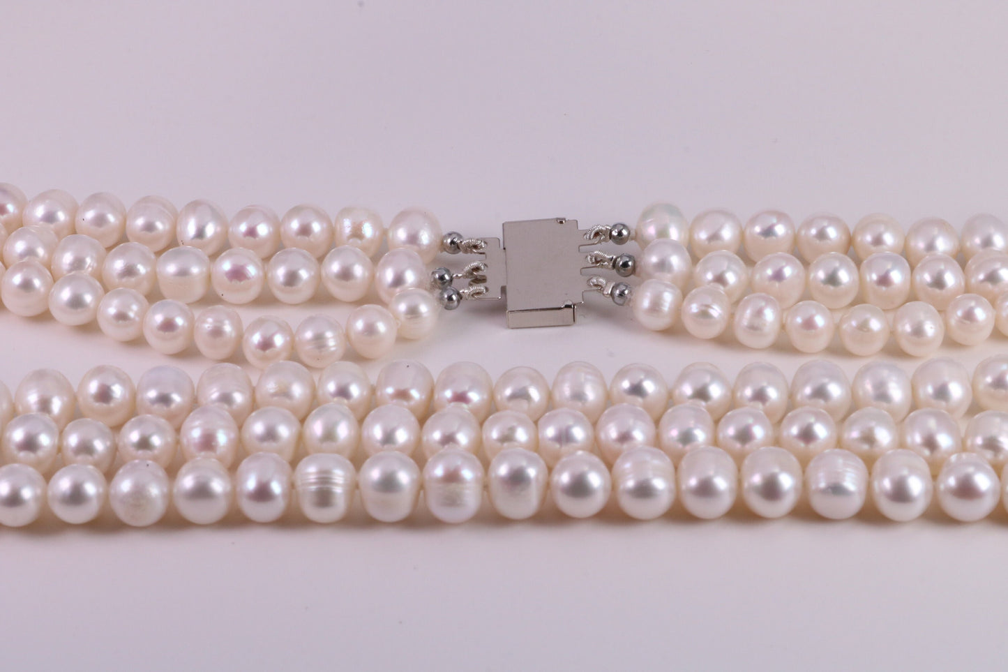 Three Strand Natural 7 mm Round Pearl Necklace set in Silver, Three Strands Measures 16, 18 and 20 inches Long