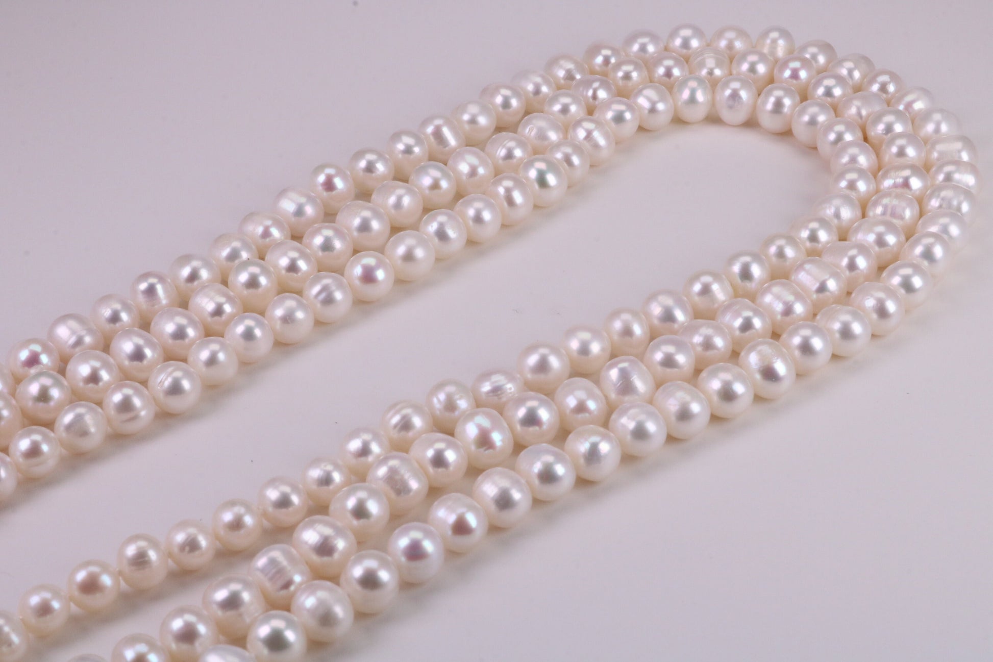 Three Strand Natural 7 mm Round Pearl Necklace set in Silver, Three Strands Measures 16, 18 and 20 inches Long