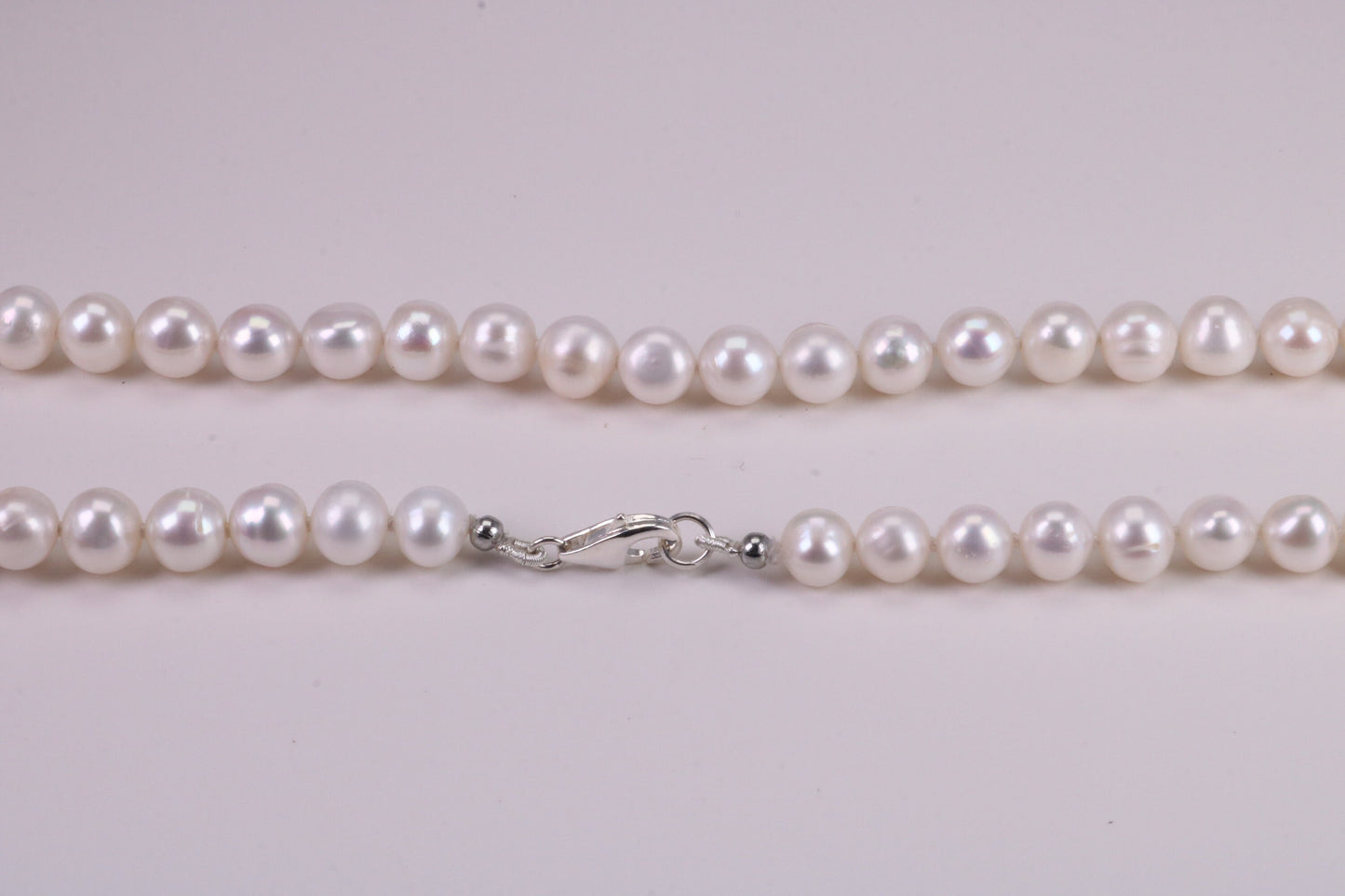 20 Inches Long Single Strand Natural 8 mm Round Pearl Necklace set in Silver