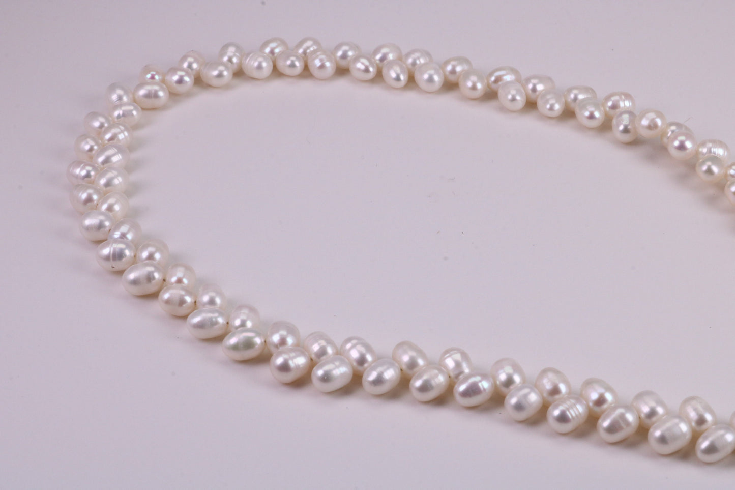 Natural 5 mm Rice Pearl Necklace set in Silver, Double Stranded and Measures 16 inches Long