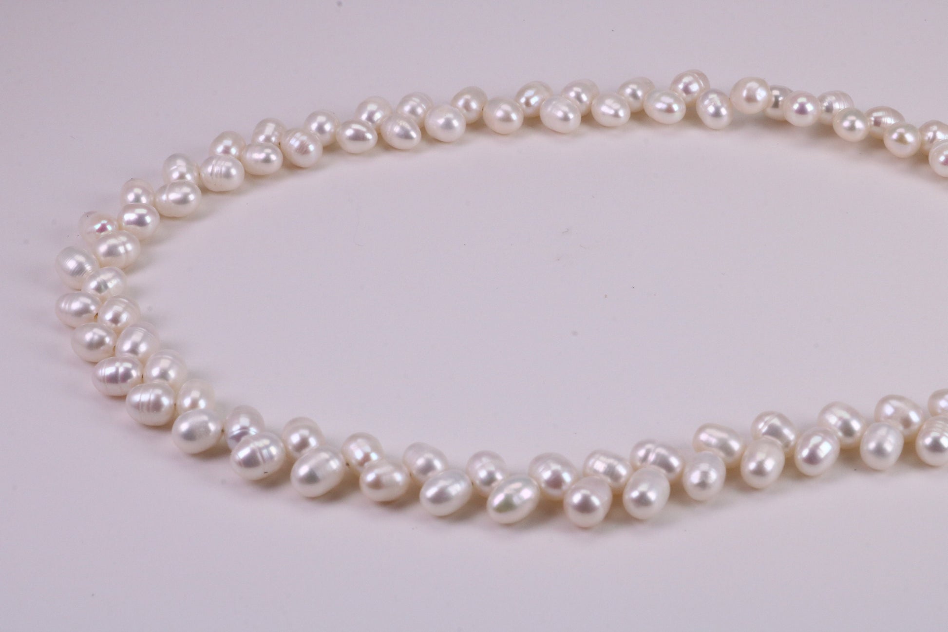 Natural 5 mm Rice Pearl Necklace set in Silver, Double Stranded and Measures 16 inches Long