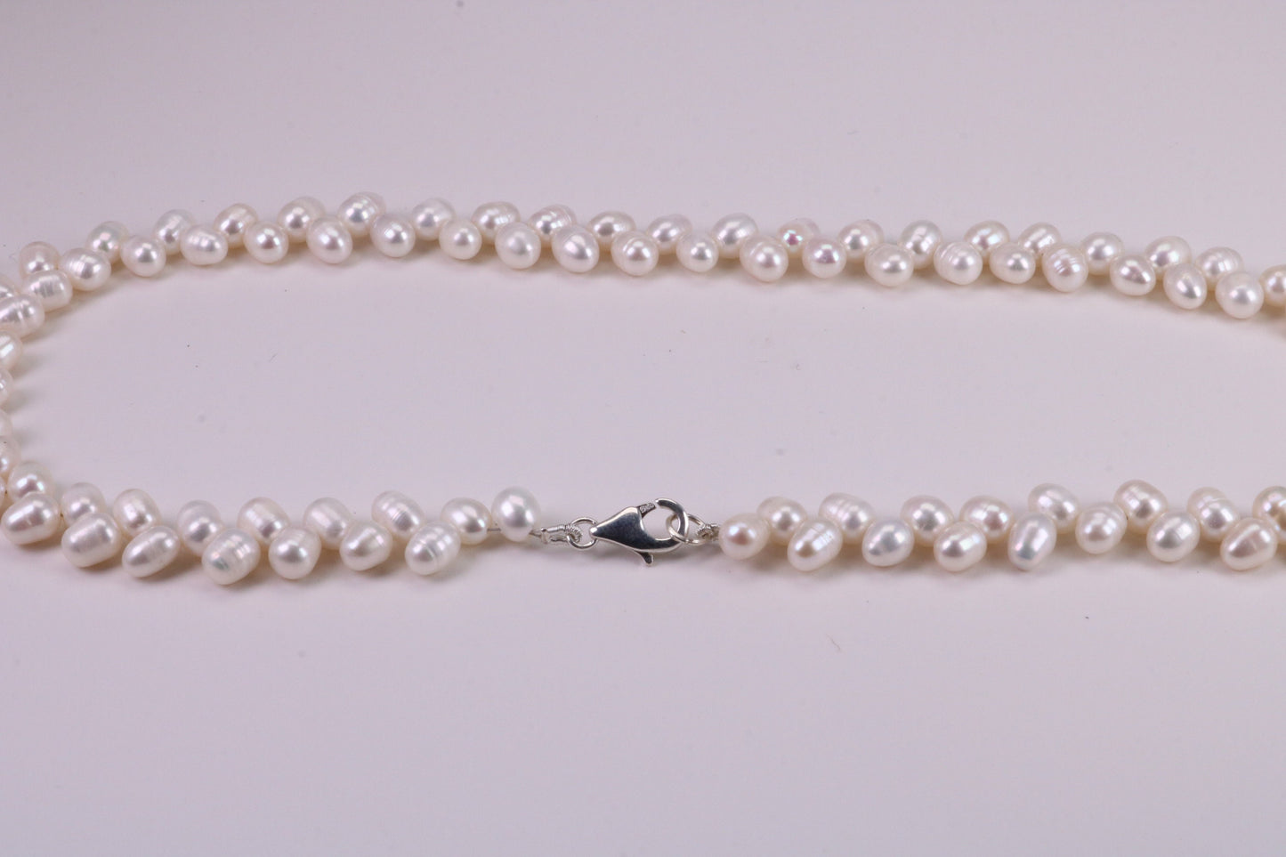 Natural 5 mm Rice Pearl Necklace set in Silver, Double Stranded and Measures 16 inches Long