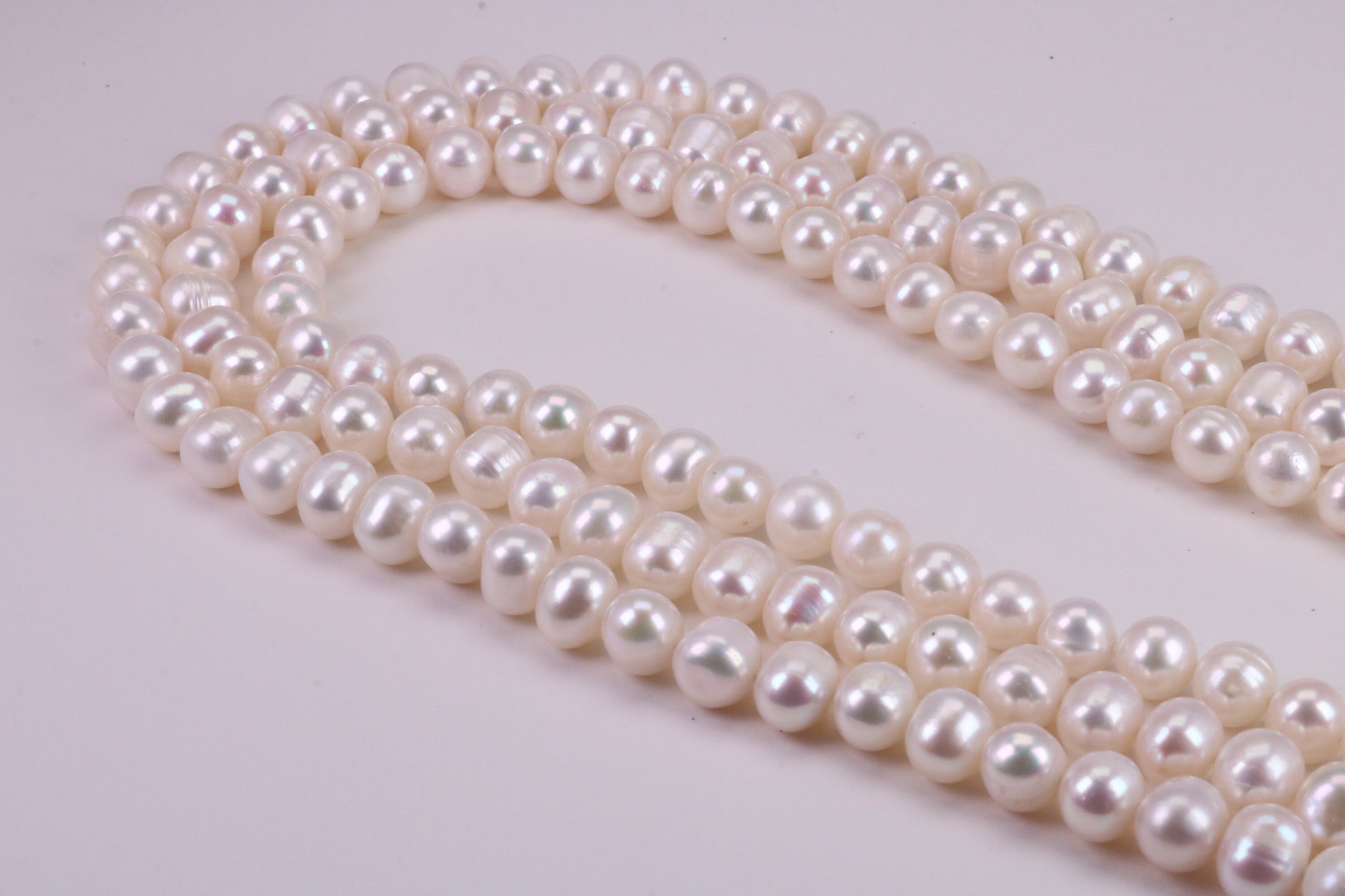 Three Strand Natural 7 mm Round Pearl Necklace set in Silver, Three Strands Measures 16, 18 and 20 inches Long