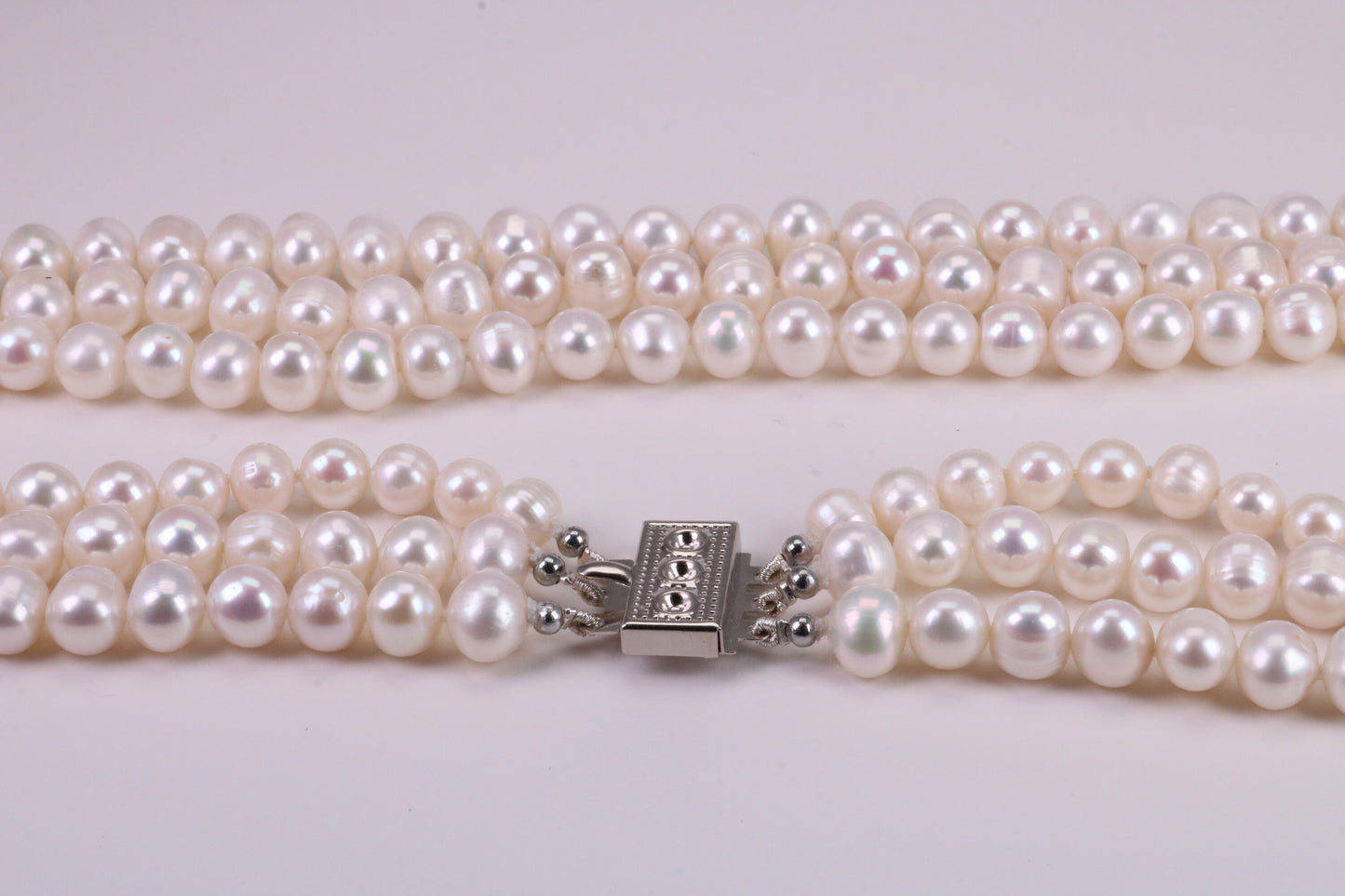 Three Strand Natural 7 mm Round Pearl Necklace set in Silver, Three Strands Measures 16, 18 and 20 inches Long