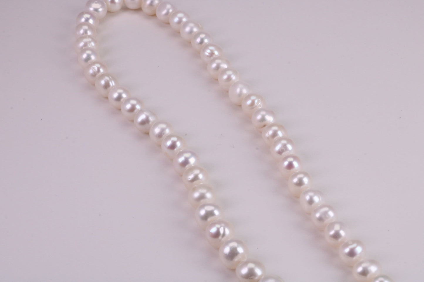 16 Inches Long Single Strand Natural 8 mm Round Pearl Necklace set in Silver