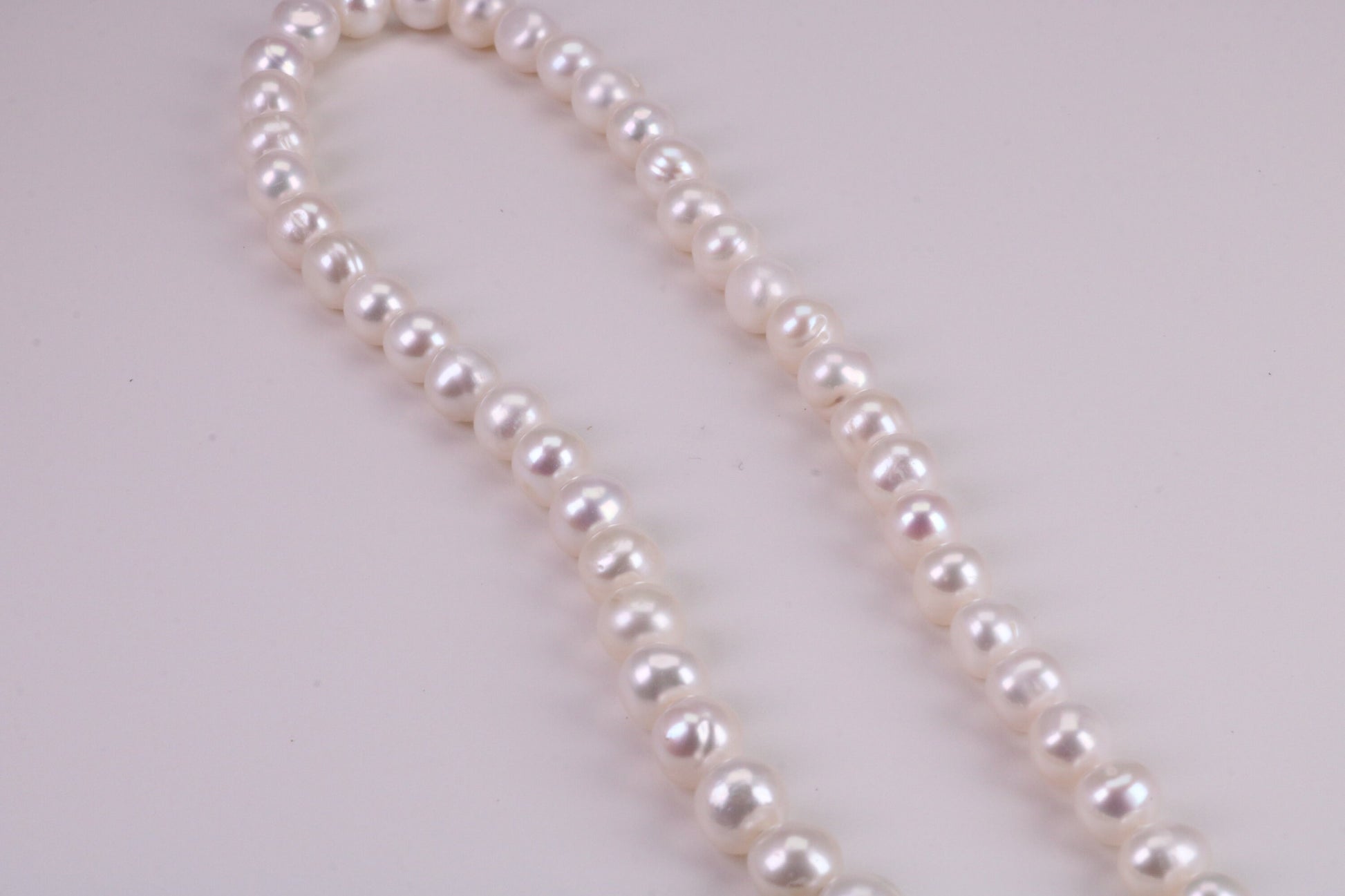 20 Inches Long Single Strand Natural 8 mm Round Pearl Necklace set in Silver