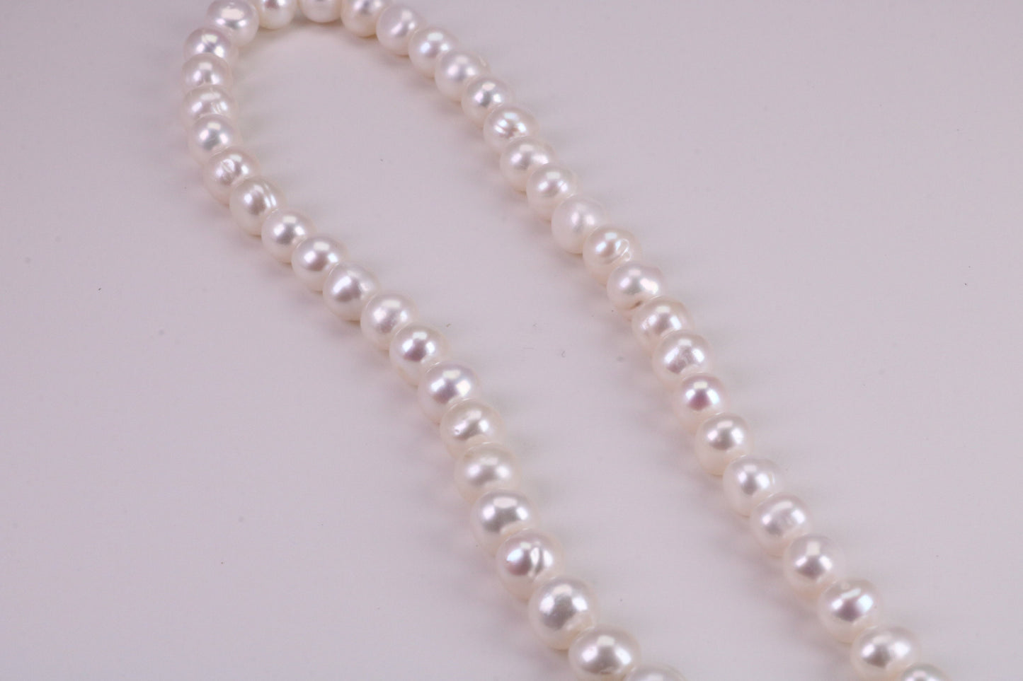 18 Inches Long Single Strand Natural 8 mm Round Pearl Necklace set in Silver