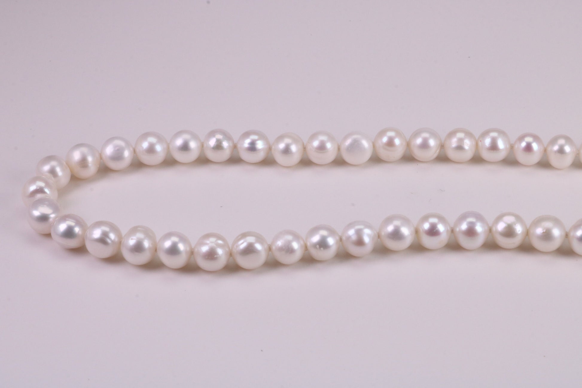 20 Inches Long Single Strand Natural 8 mm Round Pearl Necklace set in Silver
