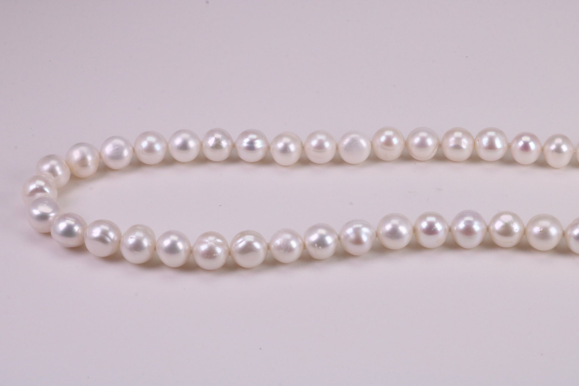 20 Inches Long Single Strand Natural 8 mm Round Pearl Necklace set in Silver