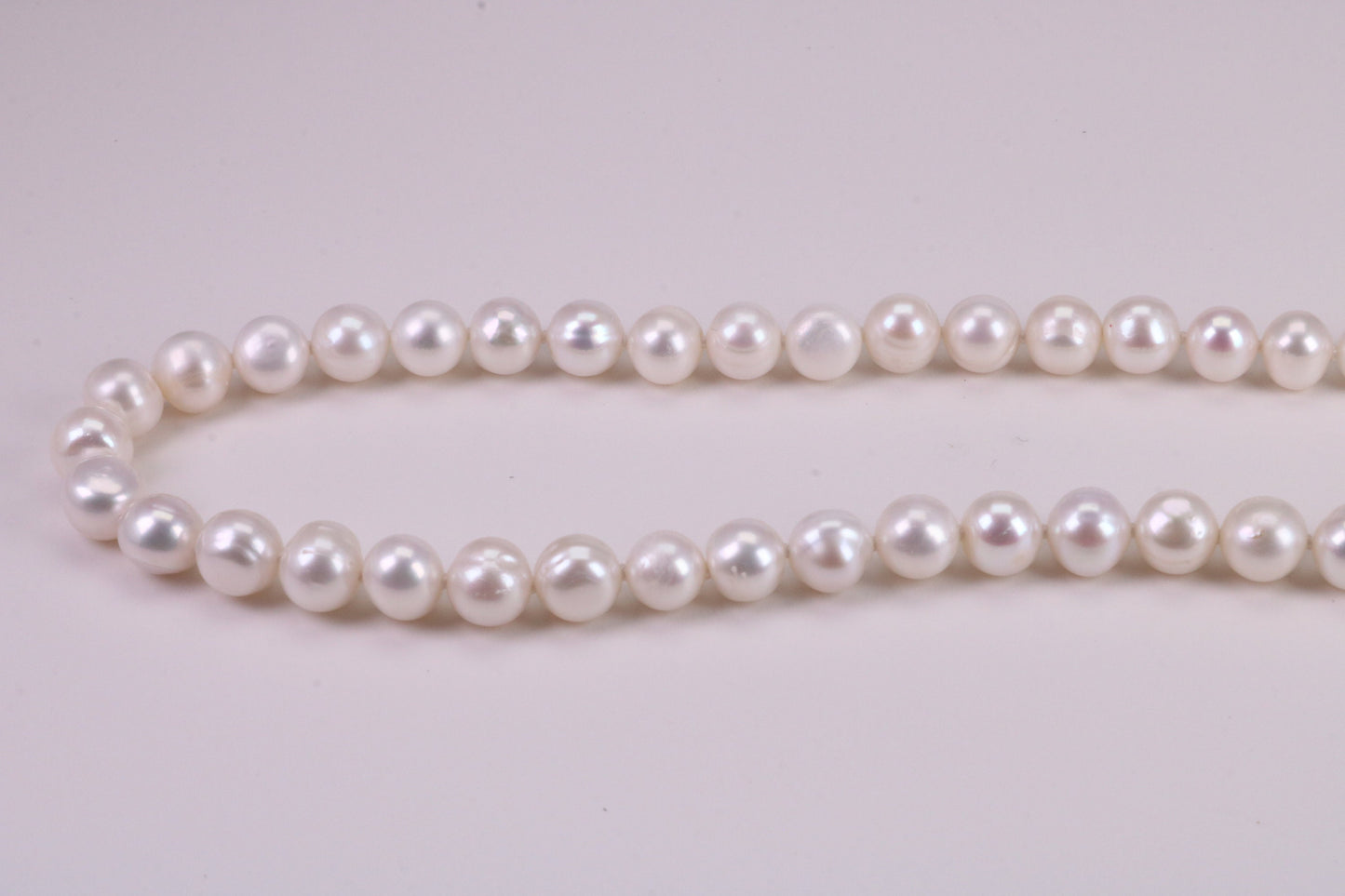 18 Inches Long Single Strand Natural 8 mm Round Pearl Necklace set in Silver