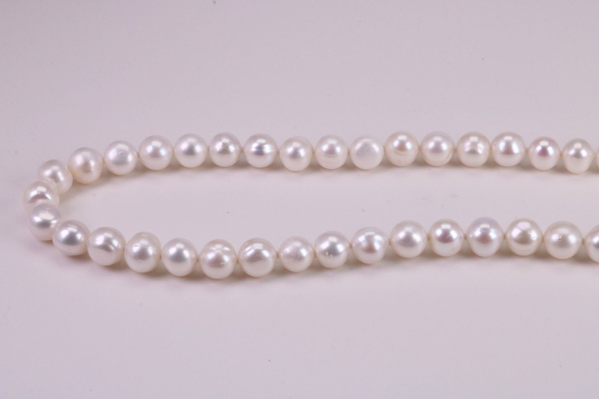 18 Inches Long Single Strand Natural 8 mm Round Pearl Necklace set in Silver