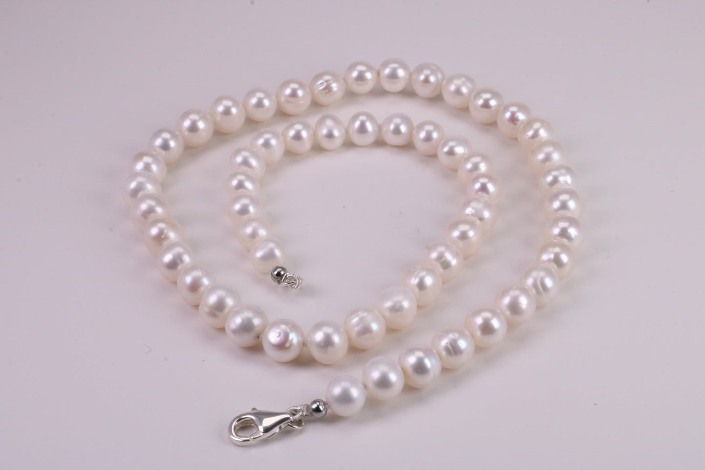 16 Inches Long Single Strand Natural 8 mm Round Pearl Necklace set in Silver