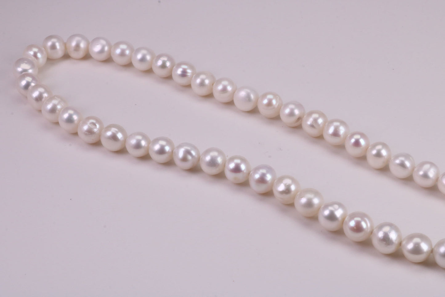 16 Inches Long Single Strand Natural 8 mm Round Pearl Necklace set in Silver