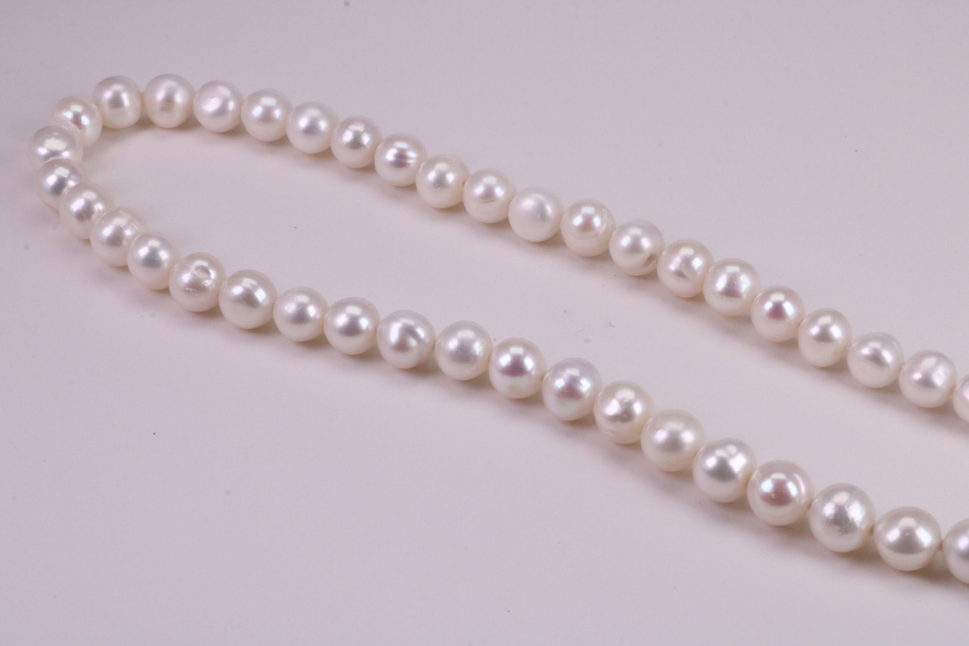 18 Inches Long Single Strand Natural 8 mm Round Pearl Necklace set in Silver