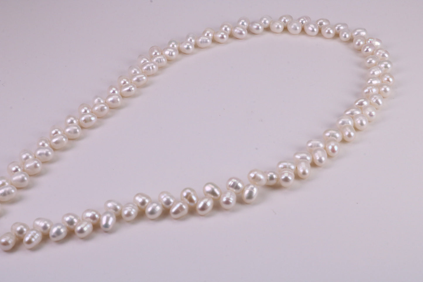 Natural 5 mm Rice Pearl Necklace set in Silver, Double Stranded and Measures 16 inches Long