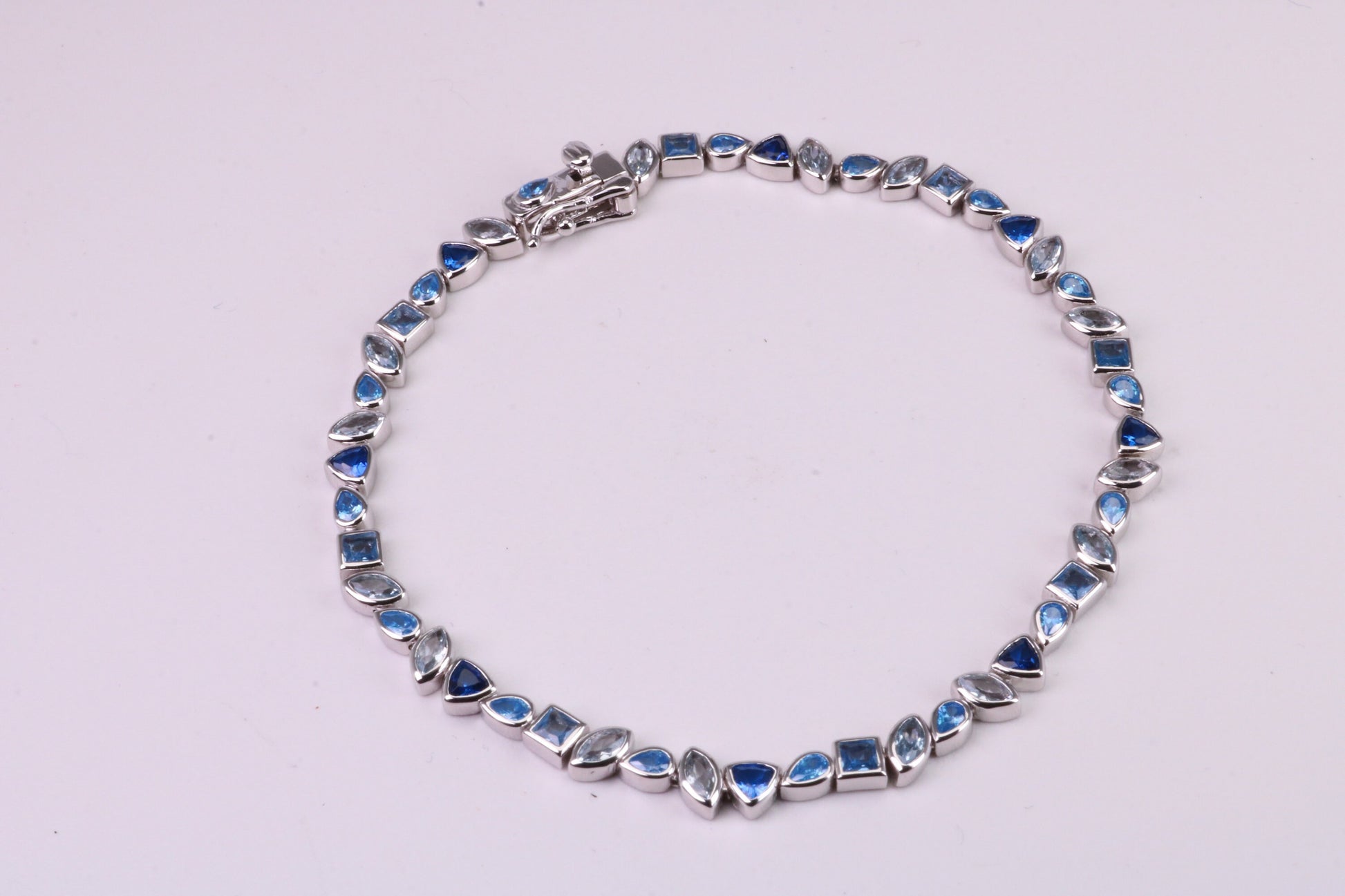 Blue Sapphire, Aquamarine and Topaz C Z Set Bracelet, 7.50 inch Length, Made from solid Sterling Silver