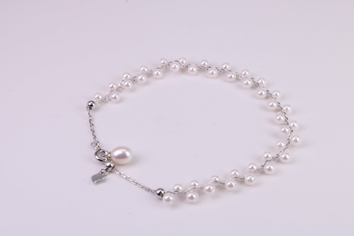 Natural 7.50 inches Long x 7 mm Wide Pearl Bracelet, made from Sterling Silver