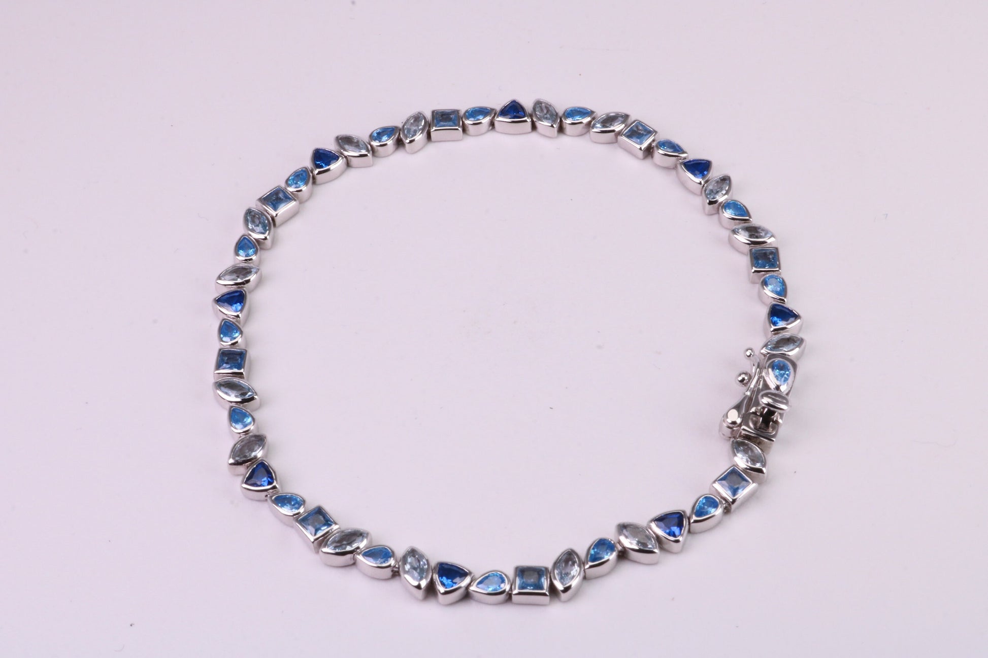 Blue Sapphire, Aquamarine and Topaz C Z Set Bracelet, 7.50 inch Length, Made from solid Sterling Silver